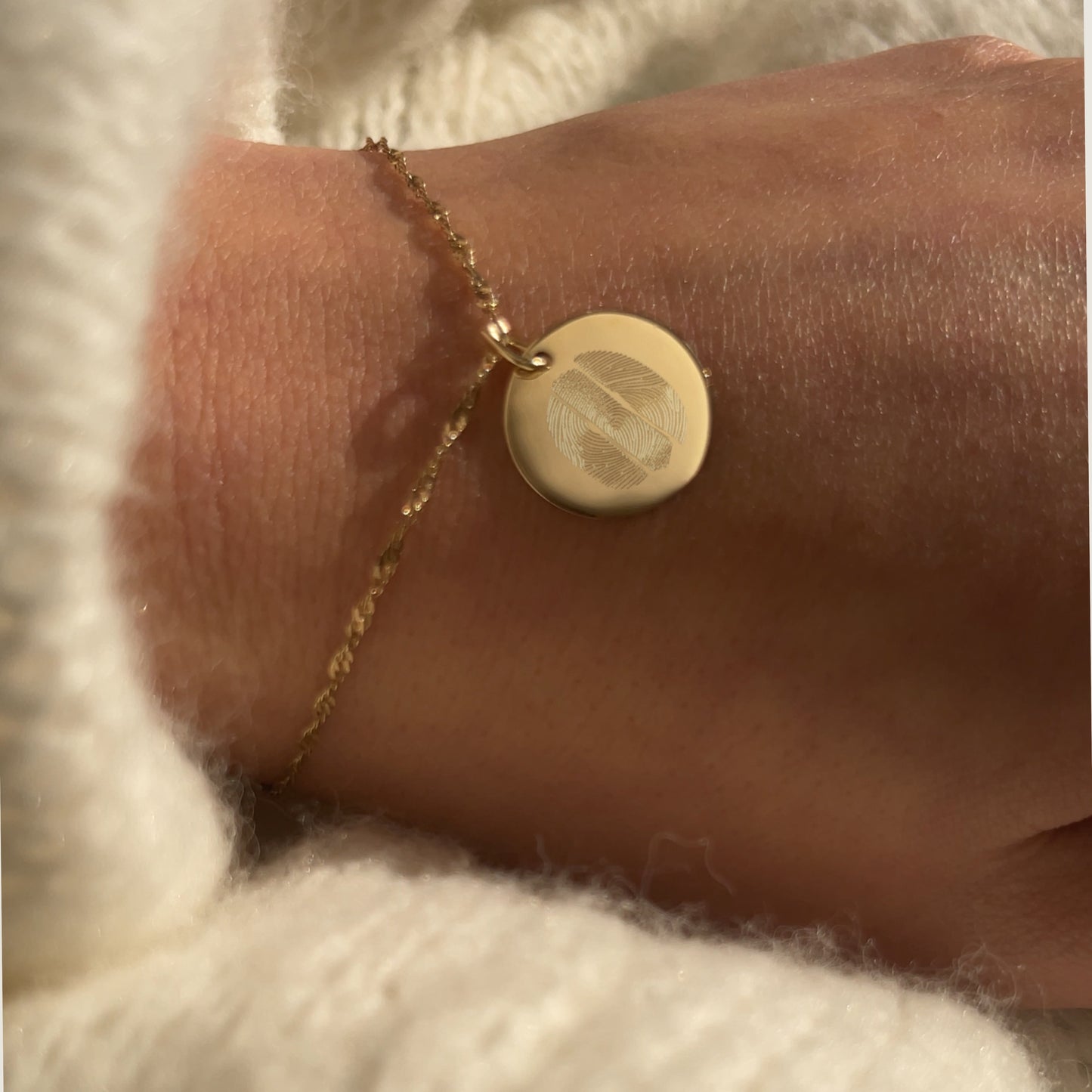 Woman's wrist with 10K solid gold three Fingerprint Personalized Memorial Engraved Bracelet with Twisted chain Jewelry