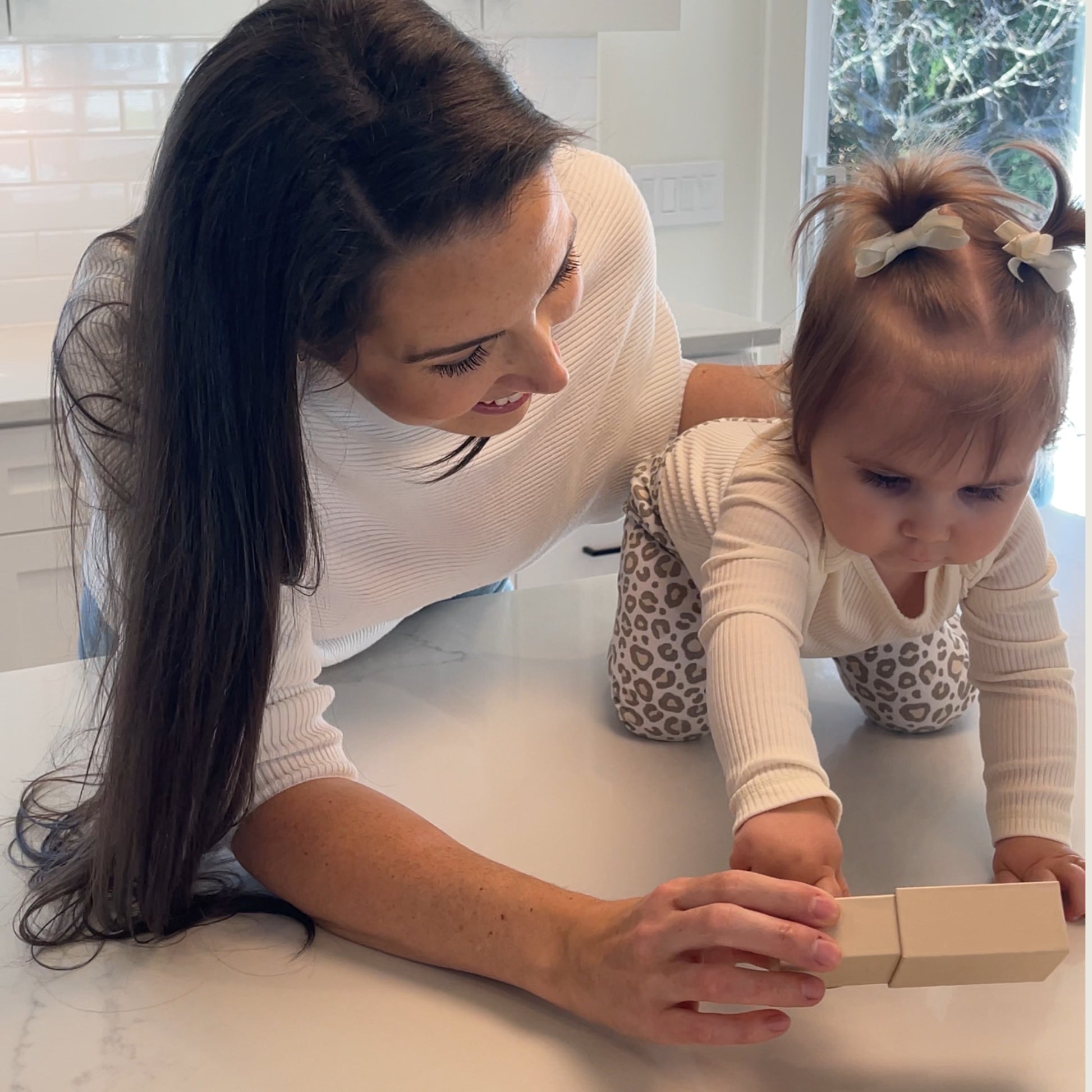 mom with baby opening her one of a kind memorial jewelry gift