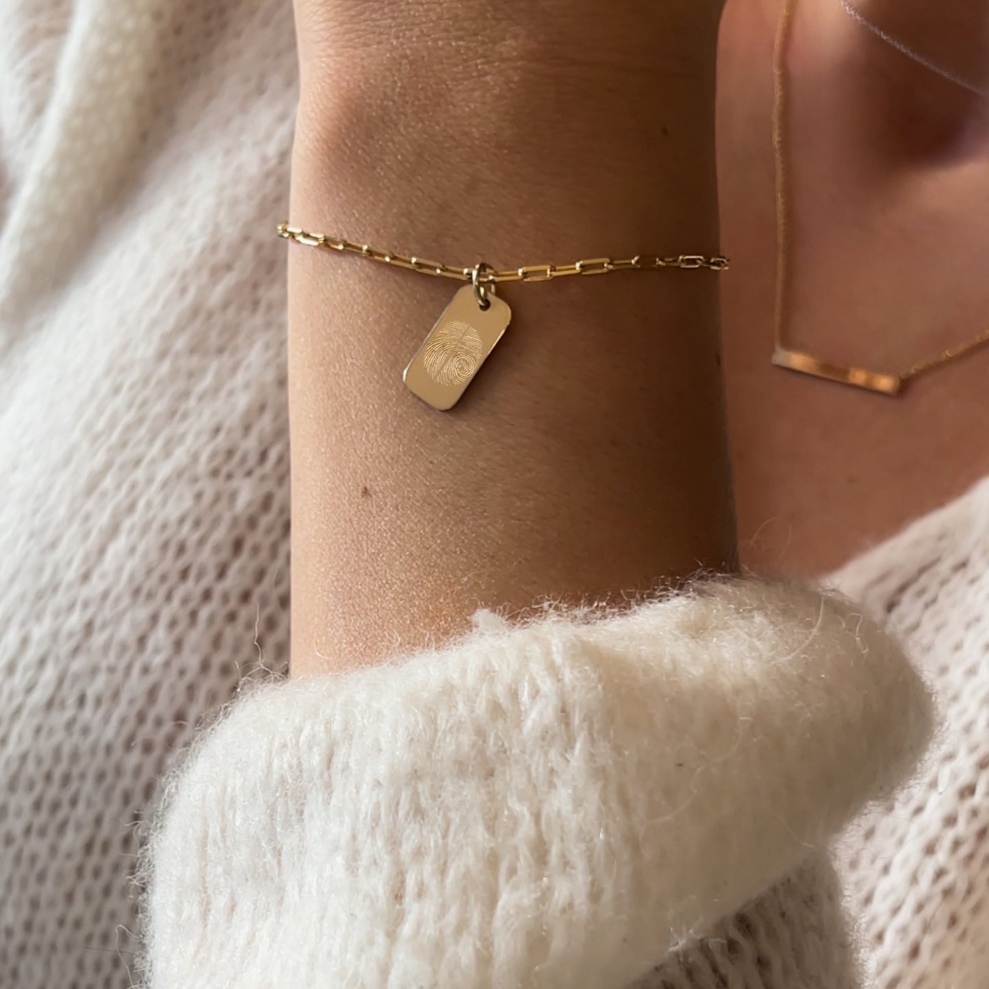 woman wearing 10K solid gold Actual Two Fingerprint Personalized Memorial Engraved Rectangle Paperclip Bracelet
