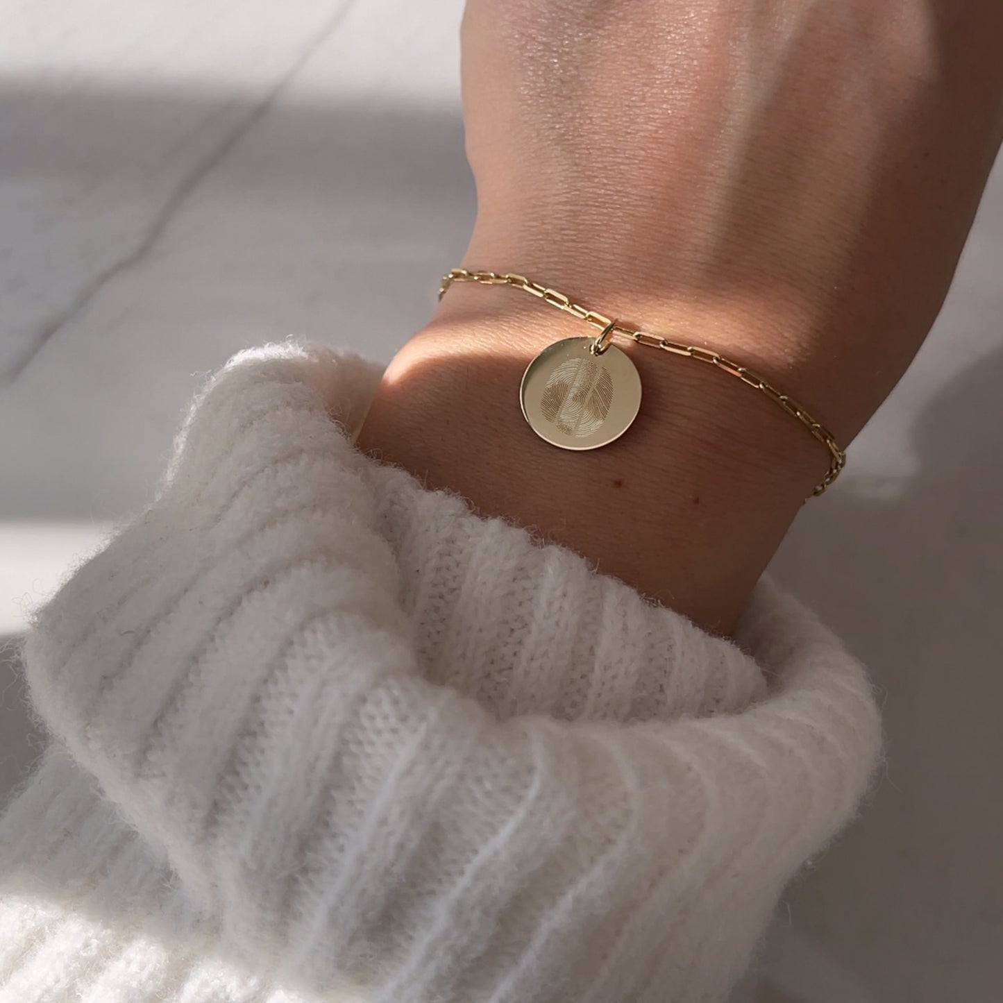 woman wearing a 10K solid gold Actual Three Fingerprint Personalized Memorial Engraved Paperclip Bracelet