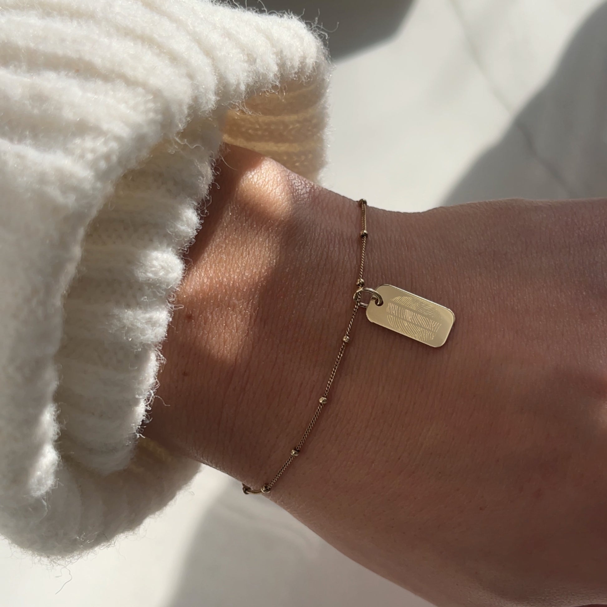 woman wearing10K solid gold Actual Three Fingerprint Personalized Rectangle Pendant on sphere chain bracelet

