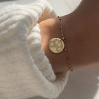 woman wearing 10K solid gold Actual Dog’s Paw print Personalized Engraved Bracelet
