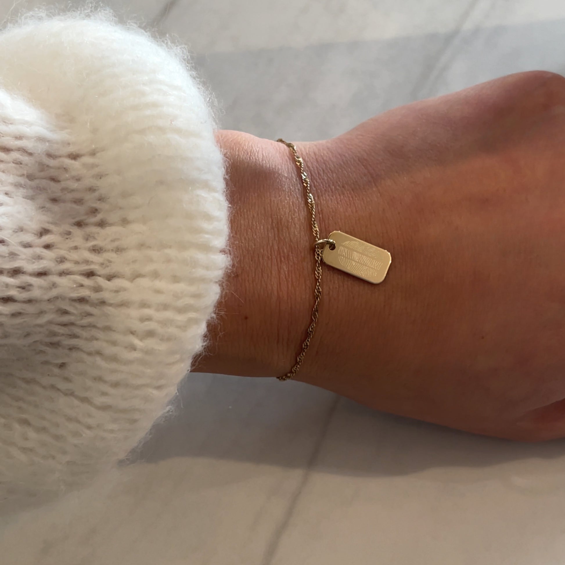 woman wearing 10K solid gold Actual Three Fingerprint Custom Memorial Engraved Rectangle Twisted Bracelet
