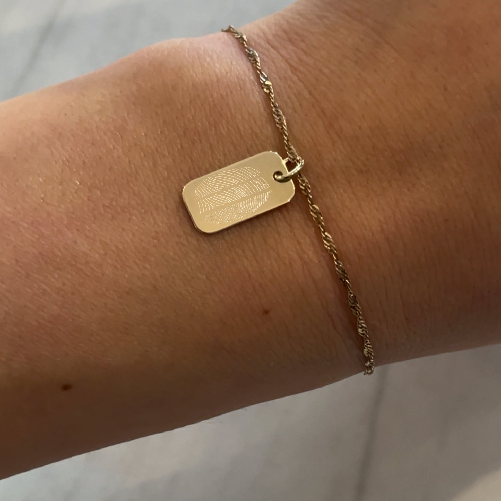 woman wearing 10K solid gold Actual Three Fingerprint Personalized Custom Memorial Engraved Rectangle Twisted Bracelet
